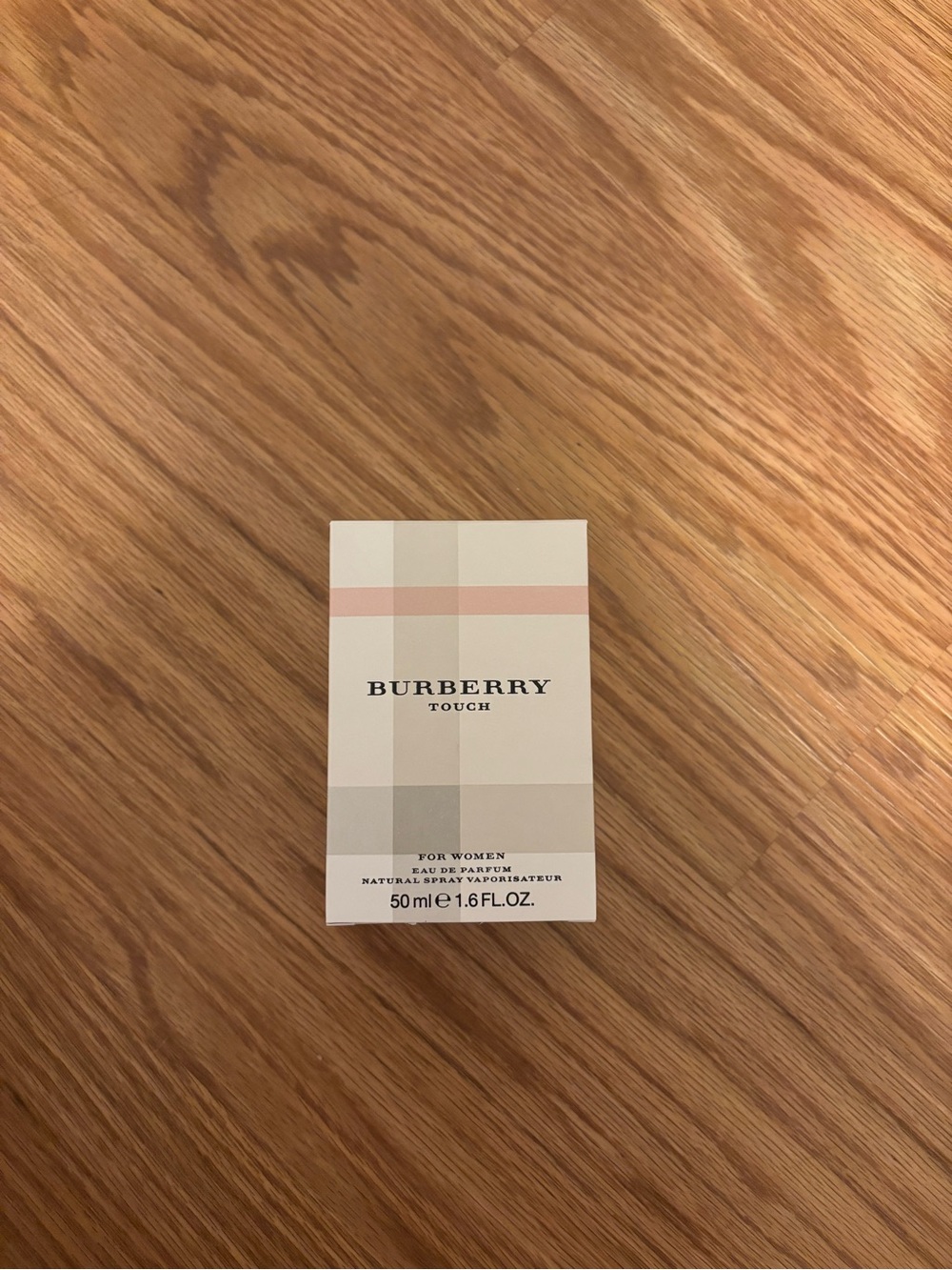 Burberry boxed product on wooden surface